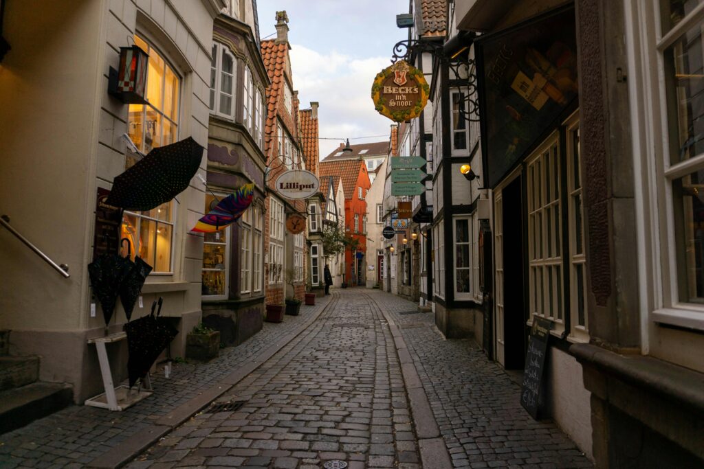 pexels photo 31991337 31991337 A picturesque cobblestone street in Bremen, Germany's historic old town, captured at dusk.